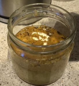glass jar with curry ingredients