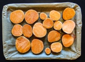 sweet potato rounds in an oven tray
