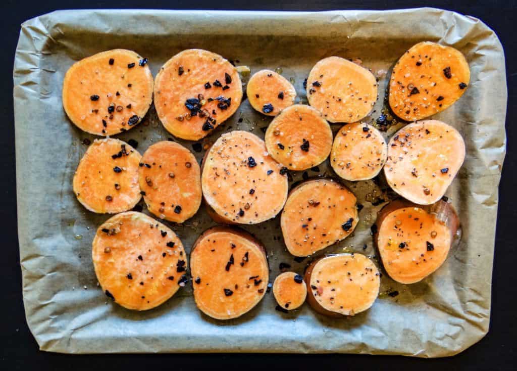 sweet potato rounds with oil pepper and salt