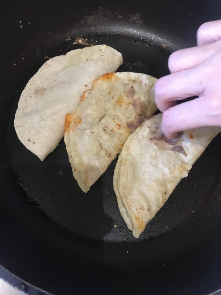 Fried tortillas with beans