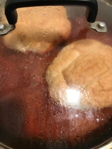 Bathing bread in guajillo sauce