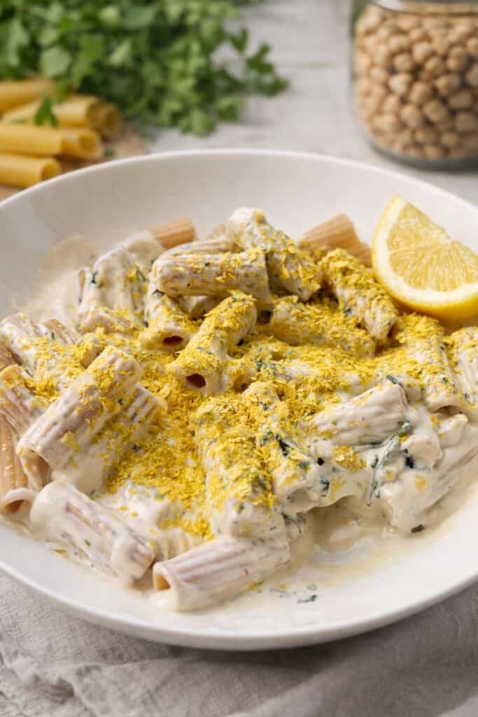 Vegan fresh pasta. Pasta with a white tofu and cashew sauce topped with nutritional yeast.